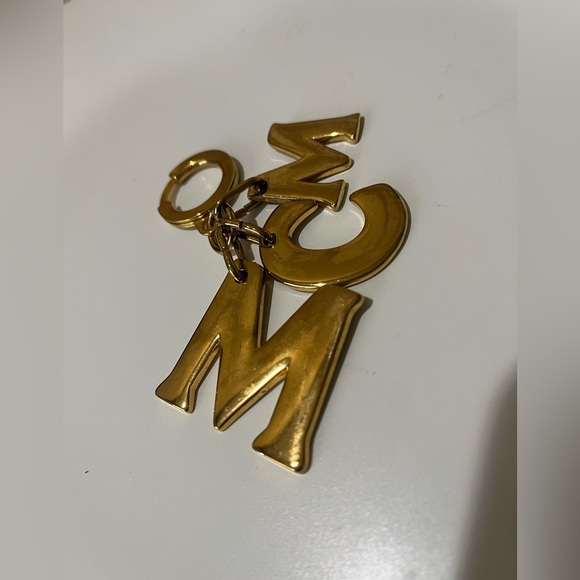 MCM GOLD CHARM